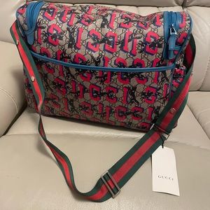 Brand new Gucci baby bag never used beautiful blue and red detail! With dust bag